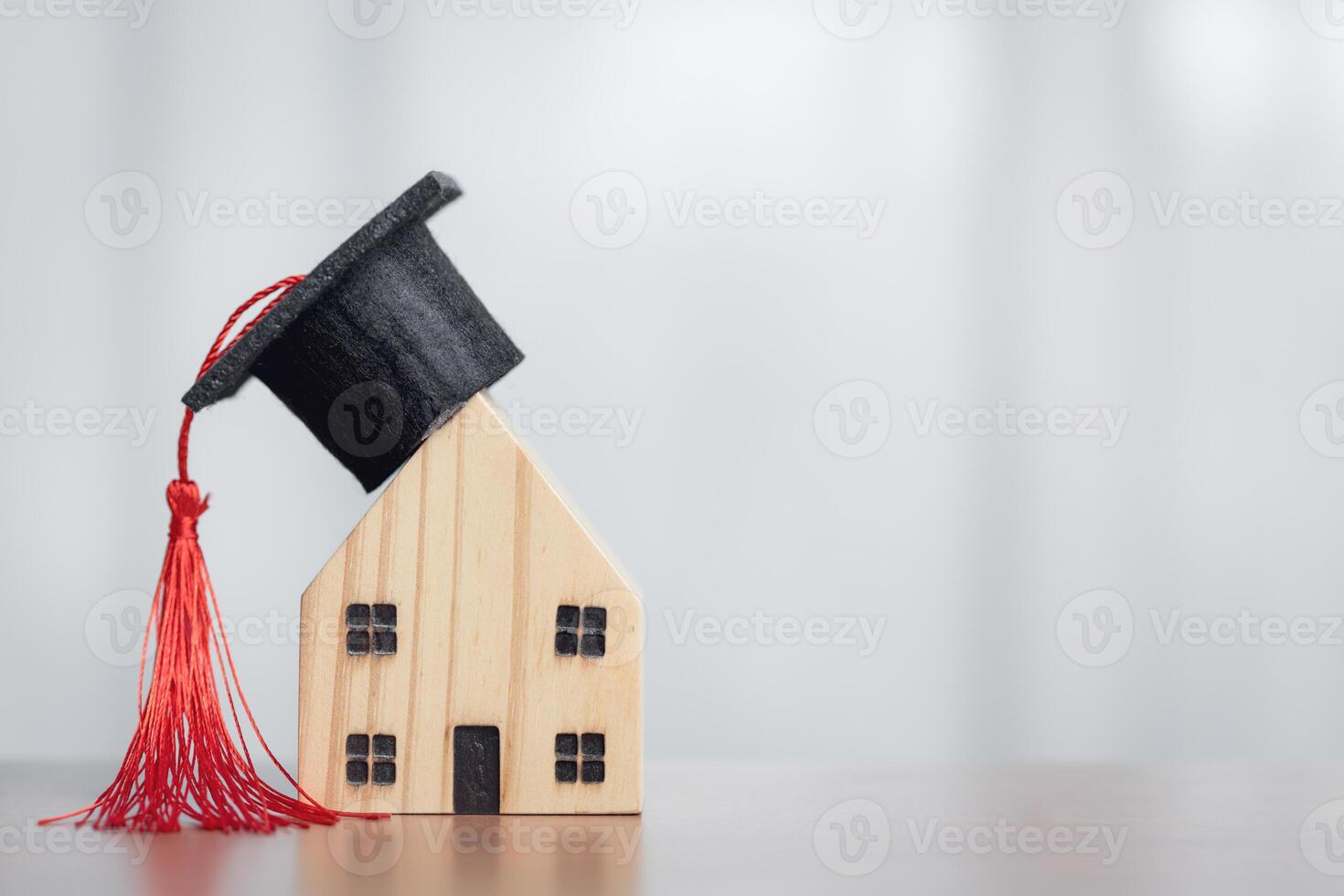 Graduation Cap on Wooden House. Concept of Education and Future Success. photo