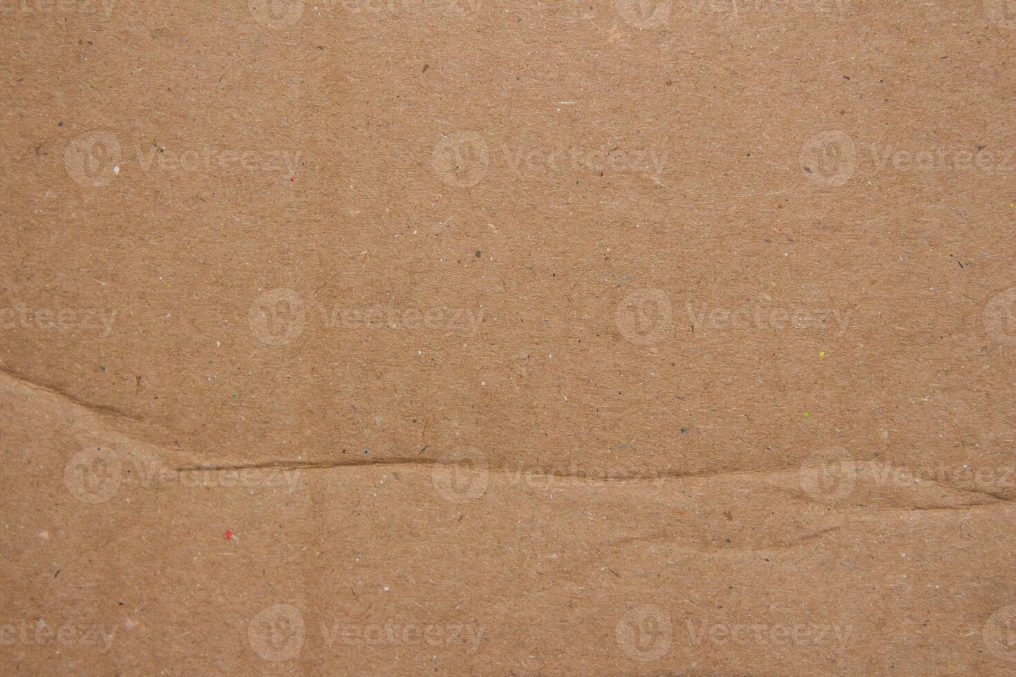 Abstract crumpled brown cardboard paper texture background design element photo