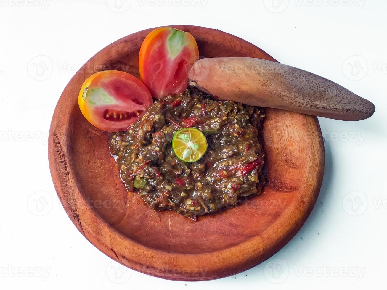 Terasi chili sauce or shrimp paste that is ground with a pestle or a traditional tool that Indonesians photo