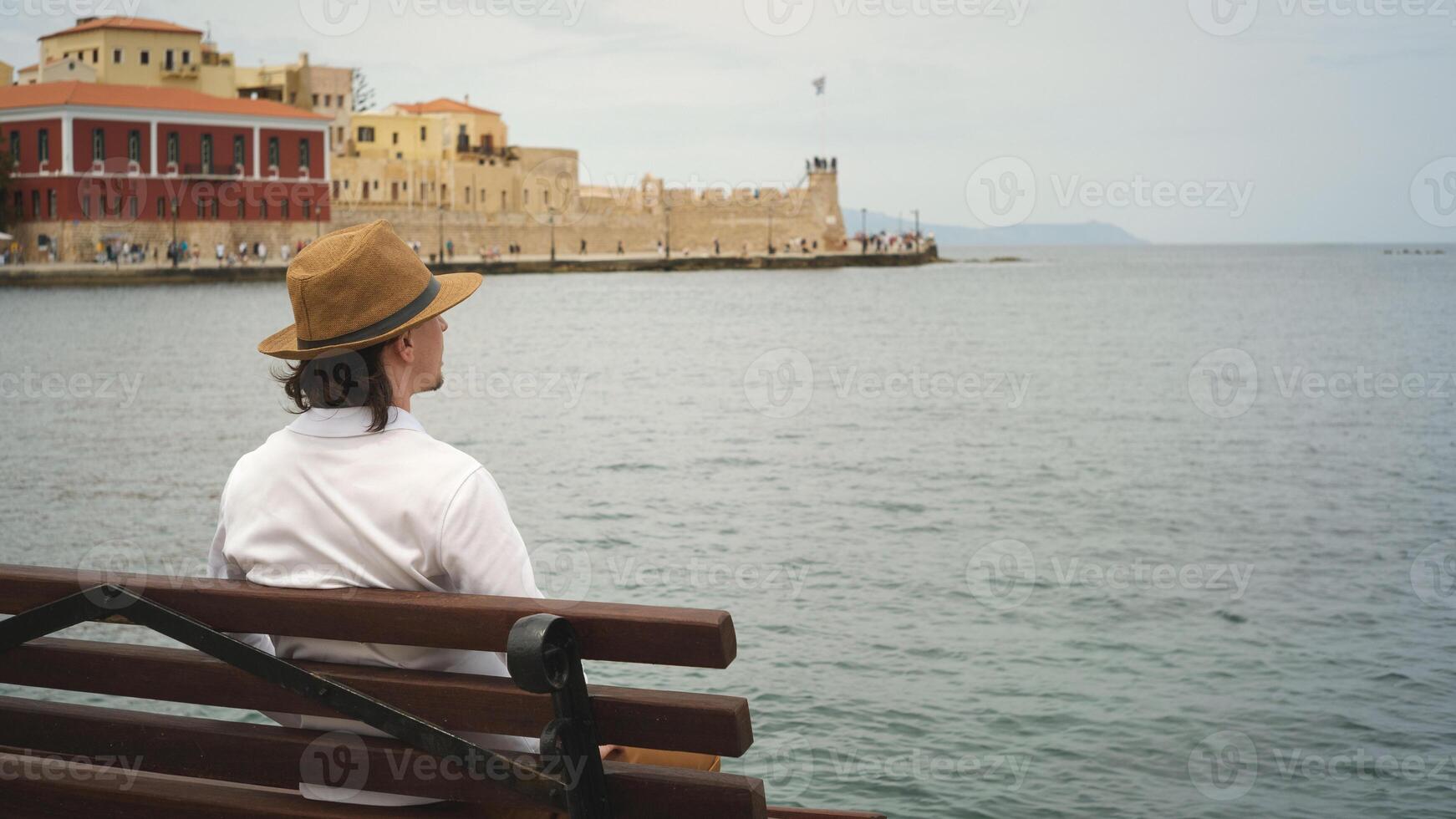 Tourist admiring venetian fortress koules in heraklion, crete, greece photo