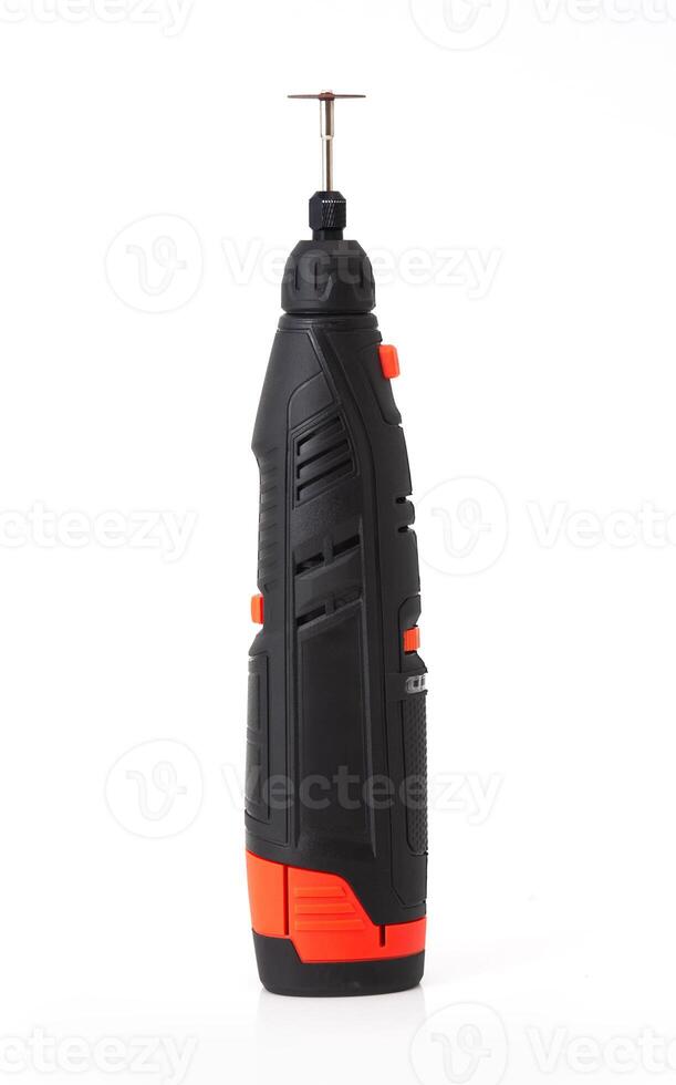 Close-up of a cordless rotary tool with cutting disc, isolated on white background, used for DIY, crafting, precision work photo