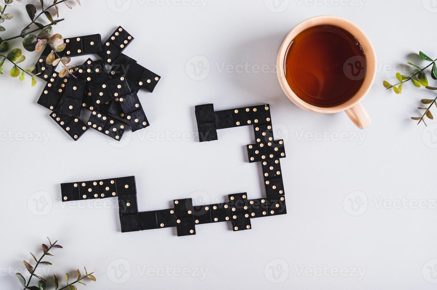 A calm domino board game for leisure on the table top view photo
