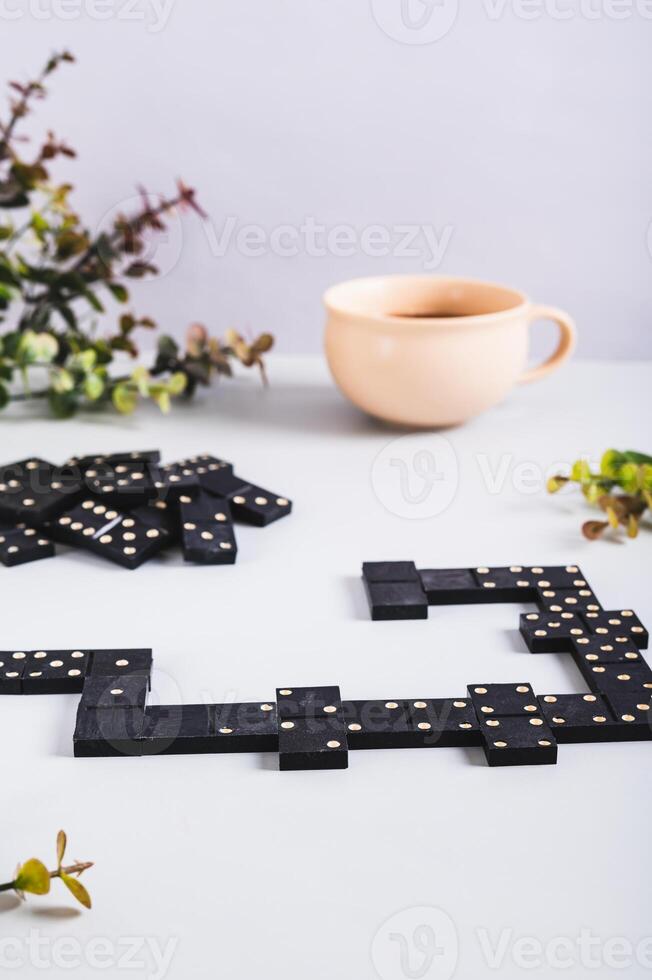 A calm domino board game for leisure on the table vertical view photo