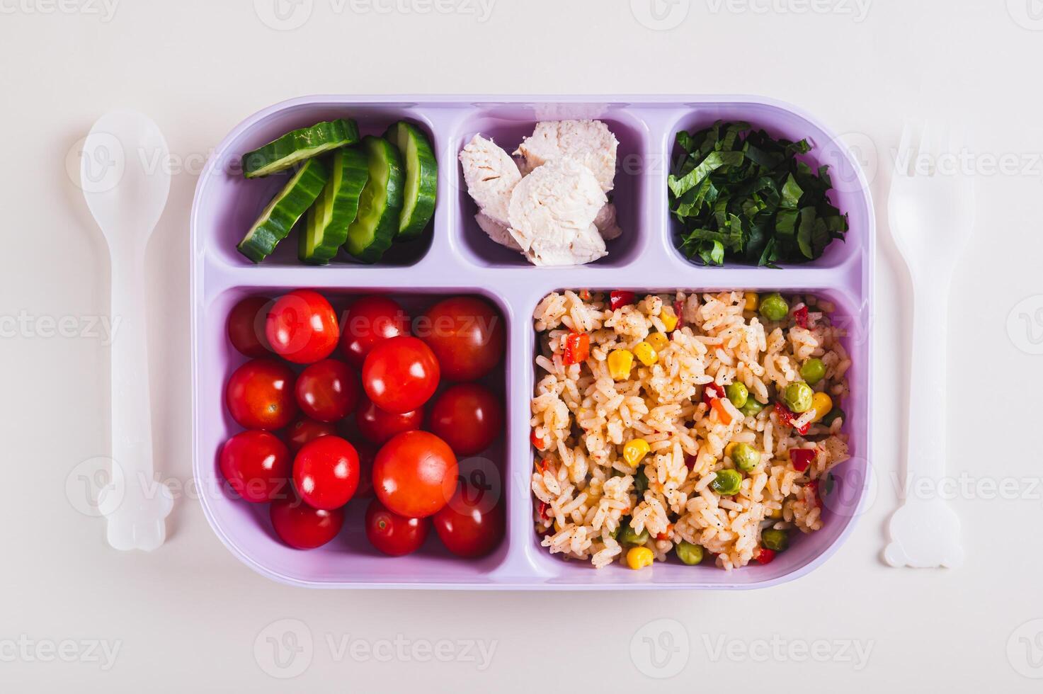 Close up of homemade lunchbox with meat, vegetables and cereals for lunch at work top view photo