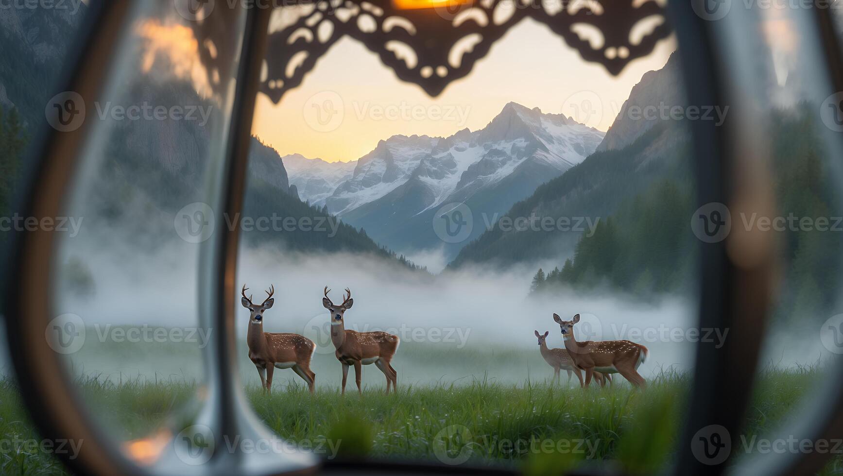 Deer Grazing in Mountain Meadow Framed by Ornate Window at Sunset photo