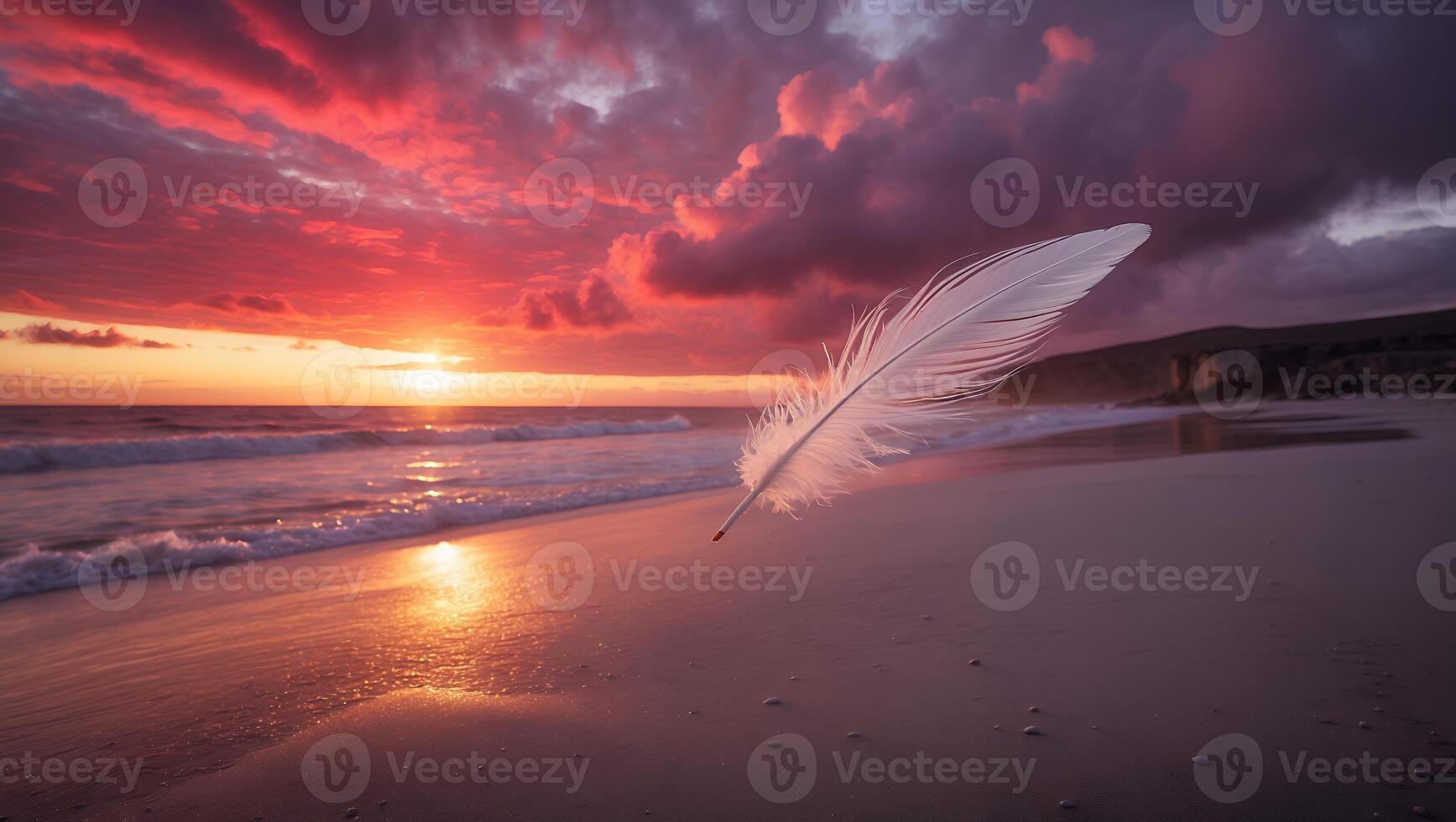 Feather Floating Above Sandy Beach at Sunset with Vibrant Sky photo