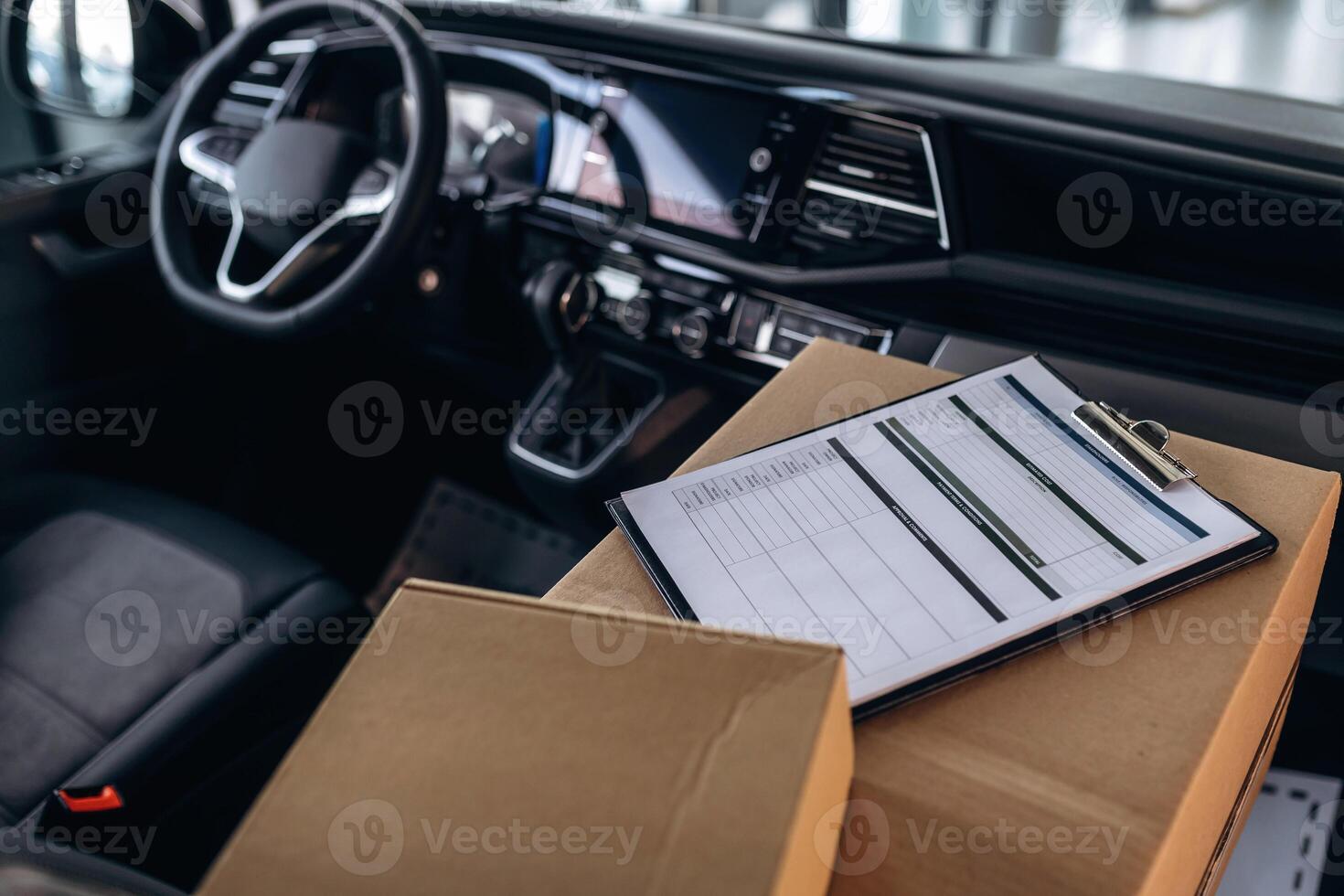Notepad on boxes in the car, conception of delivery.. photo
