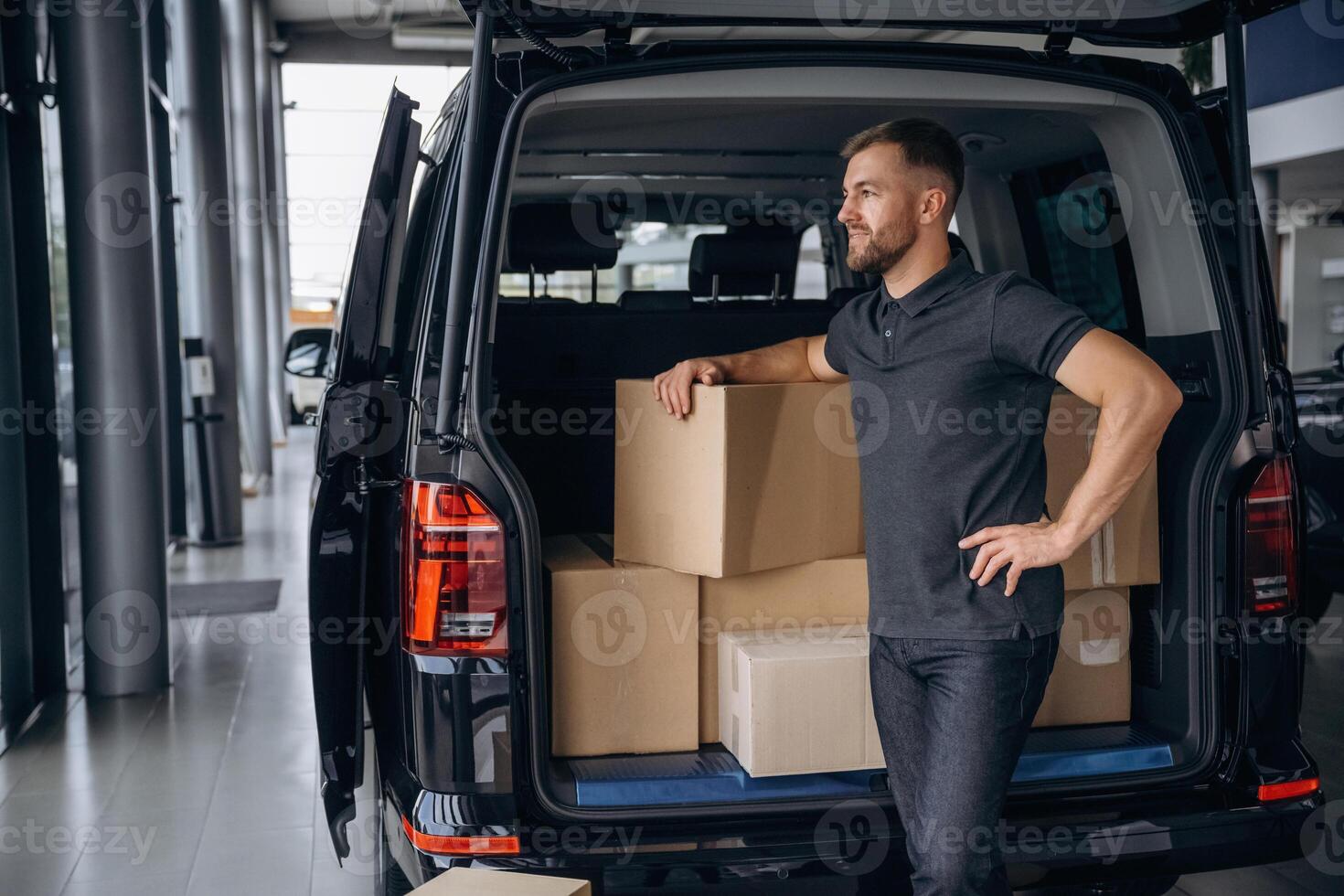 Bunch of boxes., Delivery man or loader is near the car photo
