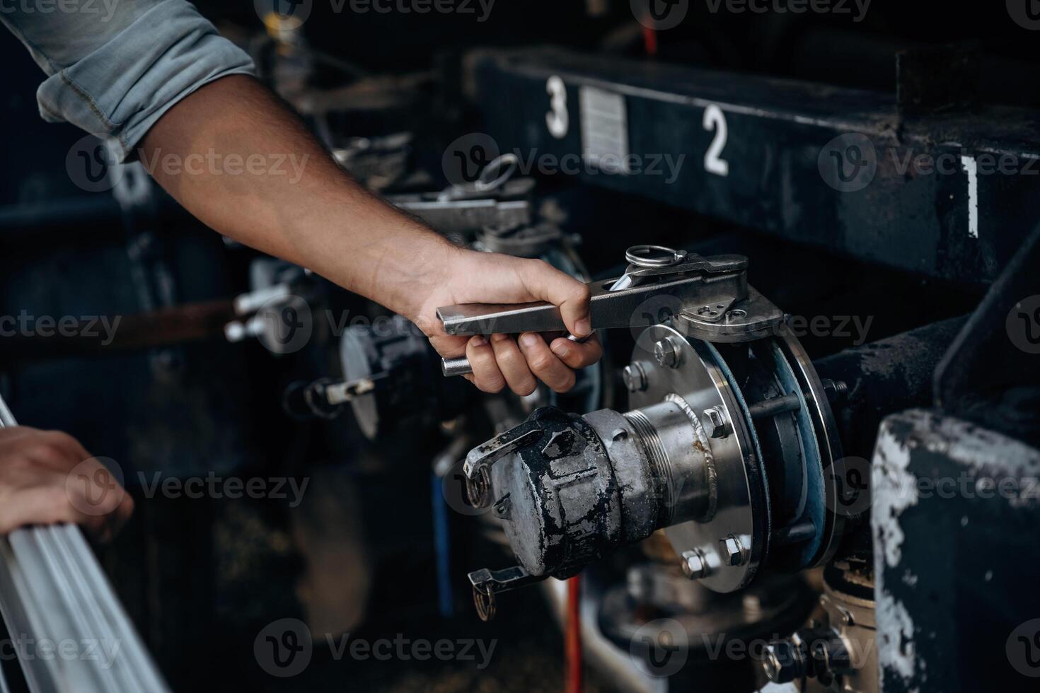 Close, up ,view of man's hand that is checking the vehicle photo
