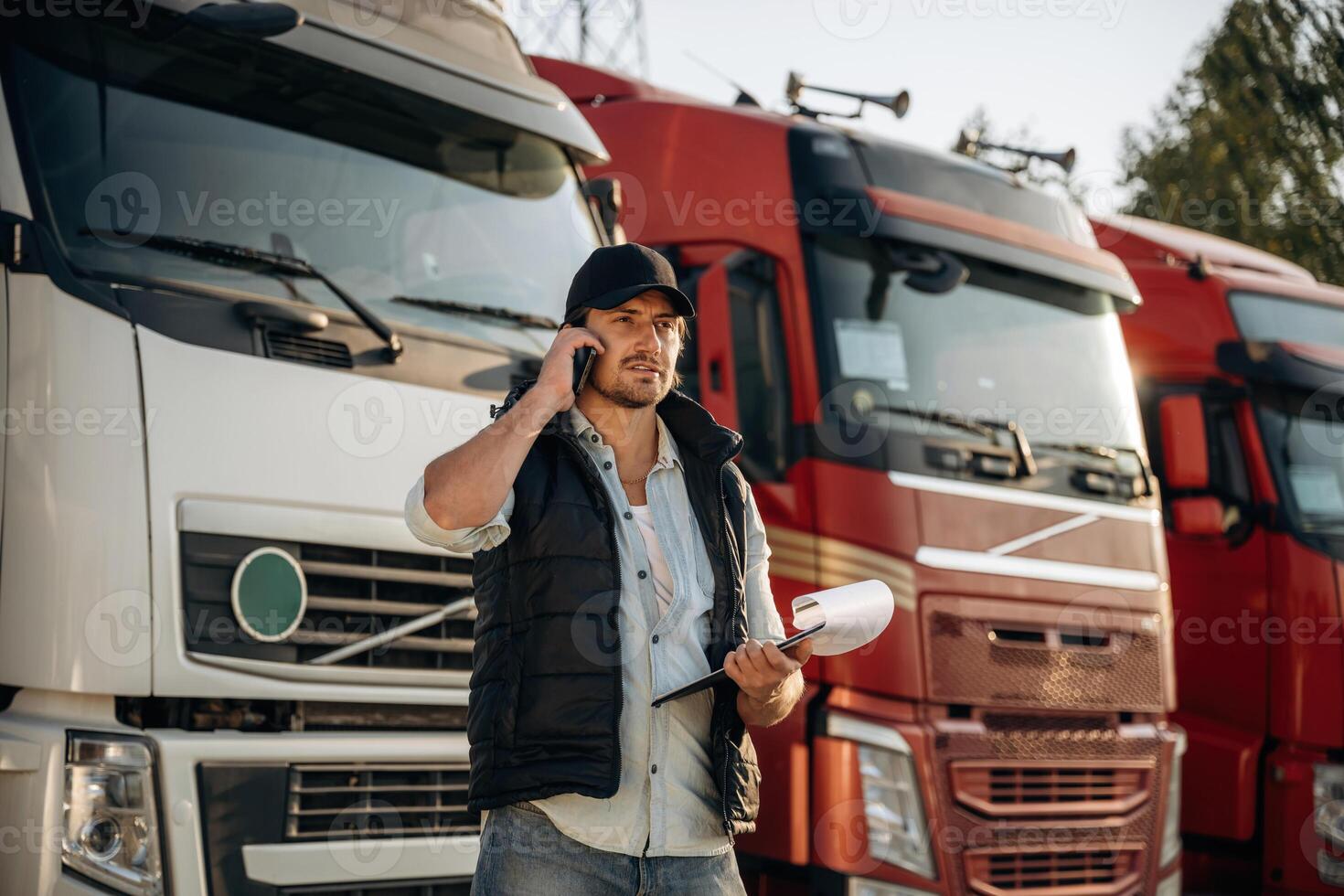 Business,, things,,, with notepad.. Truck driver is near the transport outdoors photo