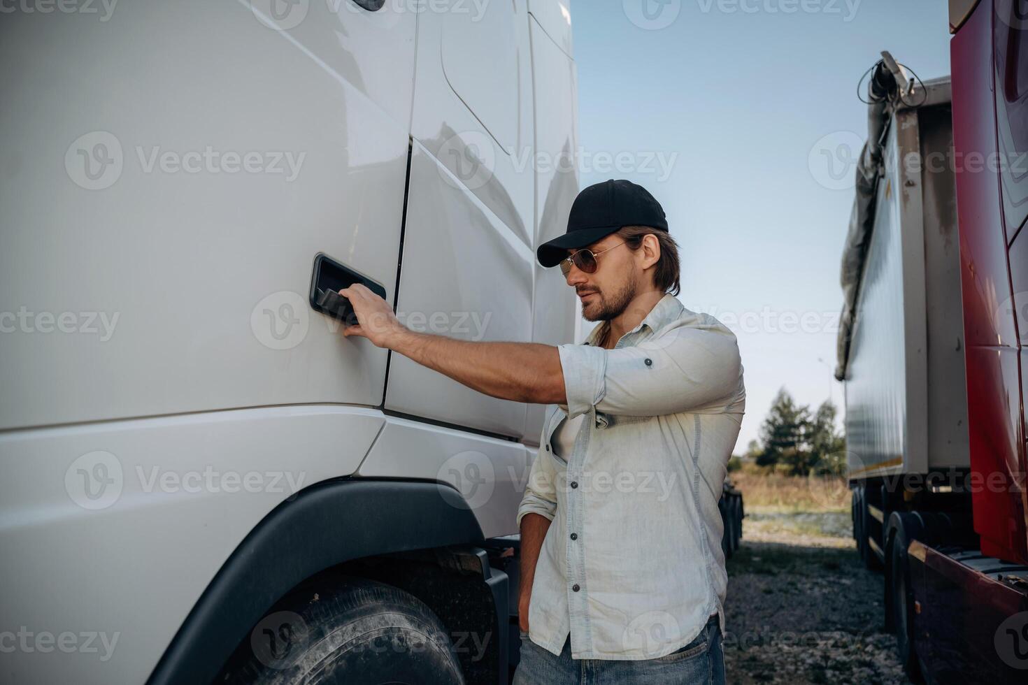 Opening ,the ,,door. Truck driver is near the transport outdoors photo