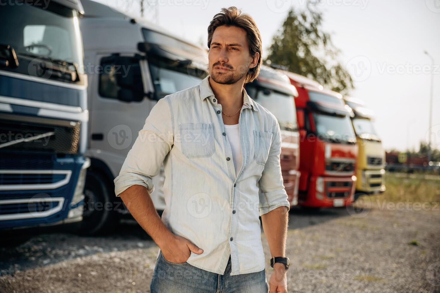 On the,, parking ,lot. Truck driver is near the transport outdoors photo