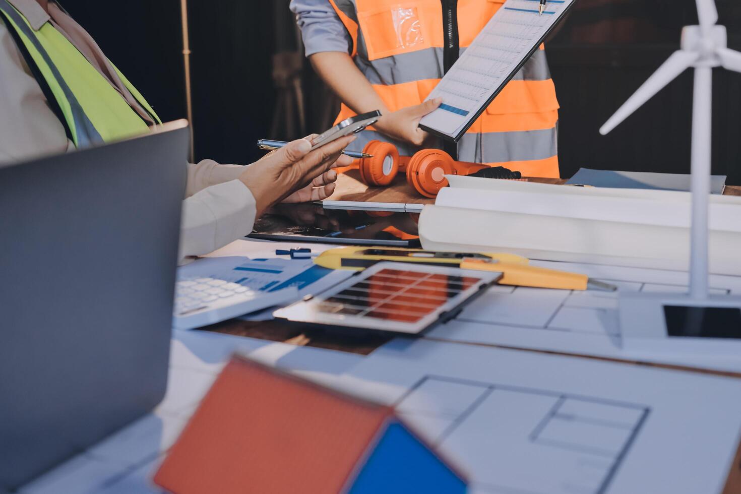A man and woman working on a project at a table photo