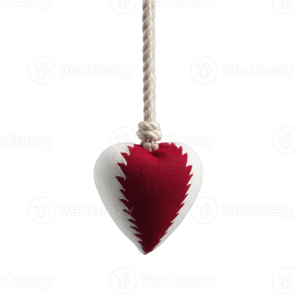 Fabric heart ornament with red and white design hangs from rope, showcasing handmade, rustic charm. heart features zigzag pattern, adding touch of whimsy png