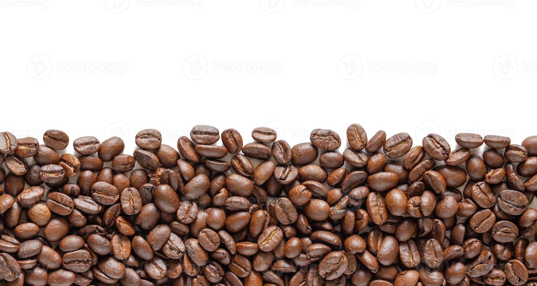 Roasted coffee beans on a white background. Coffee beans background with area for copy space. Close up images. photo