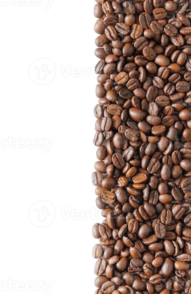 Many roasted coffee beans on white background. Coffee beans background with area for copy space. Close up. photo