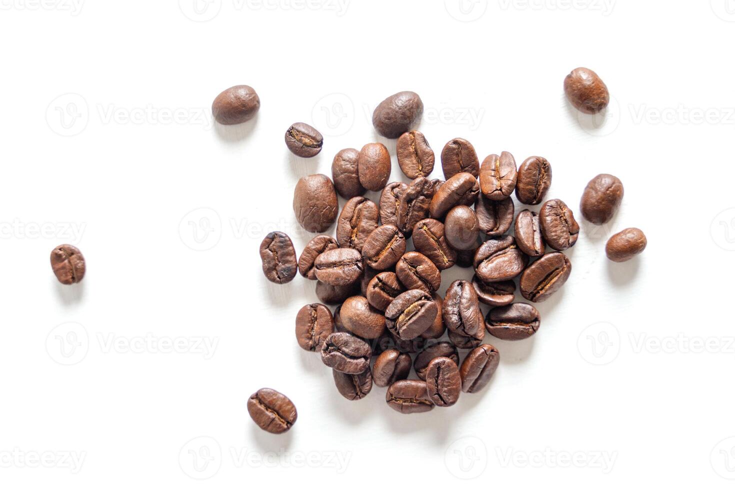Brown roasted coffee beans seed. Isolated of coffee bean on white background. Close up image. photo
