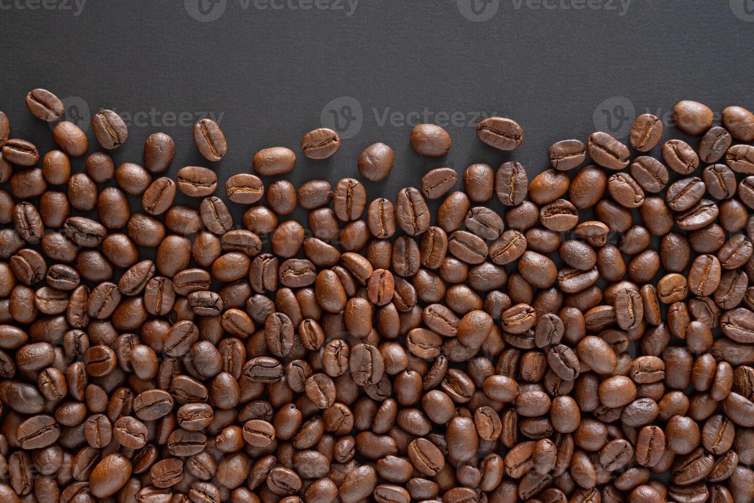 Coffee beans background. Top view coffee beans with copy space area for your text. Close up. photo