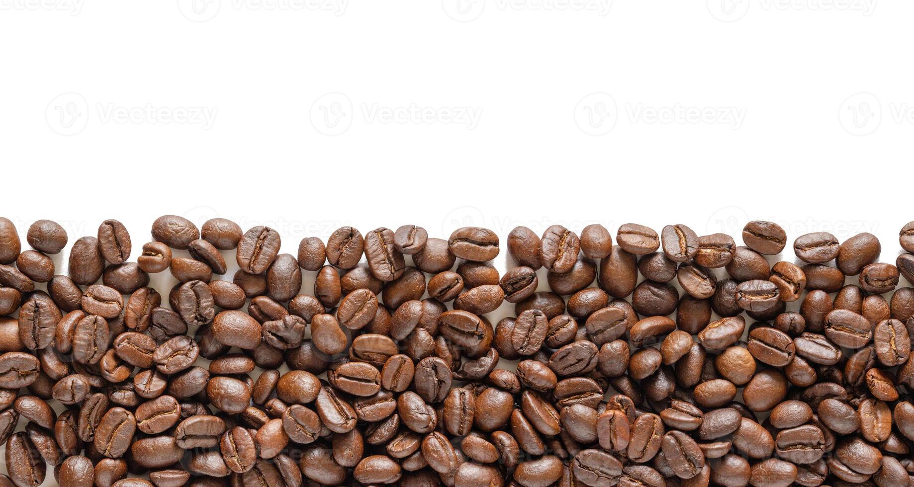 Coffee beans on white background. Coffee beans background with area for copy space. Close up image. photo