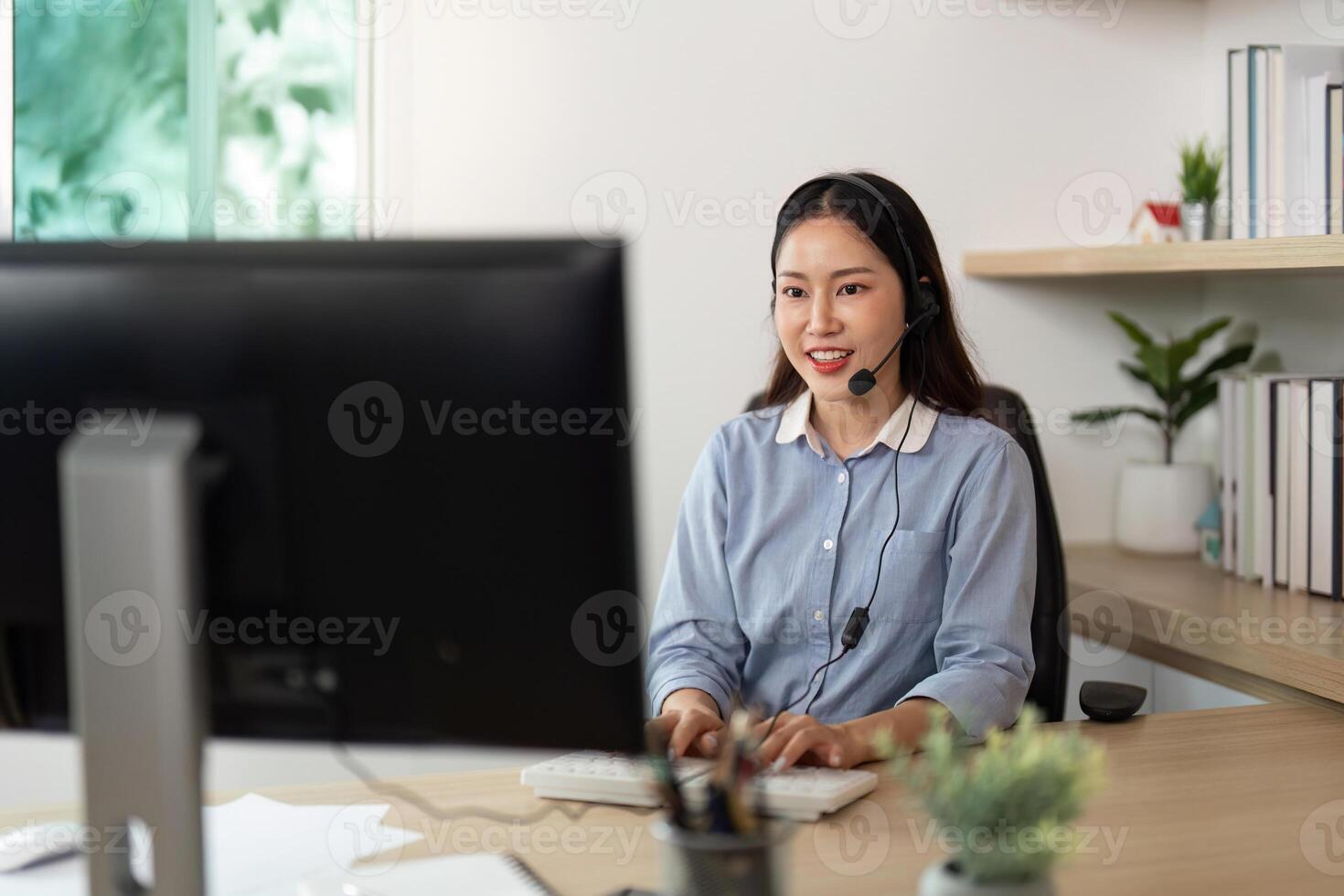 Call Center Agent Working Efficiently in Home Office photo