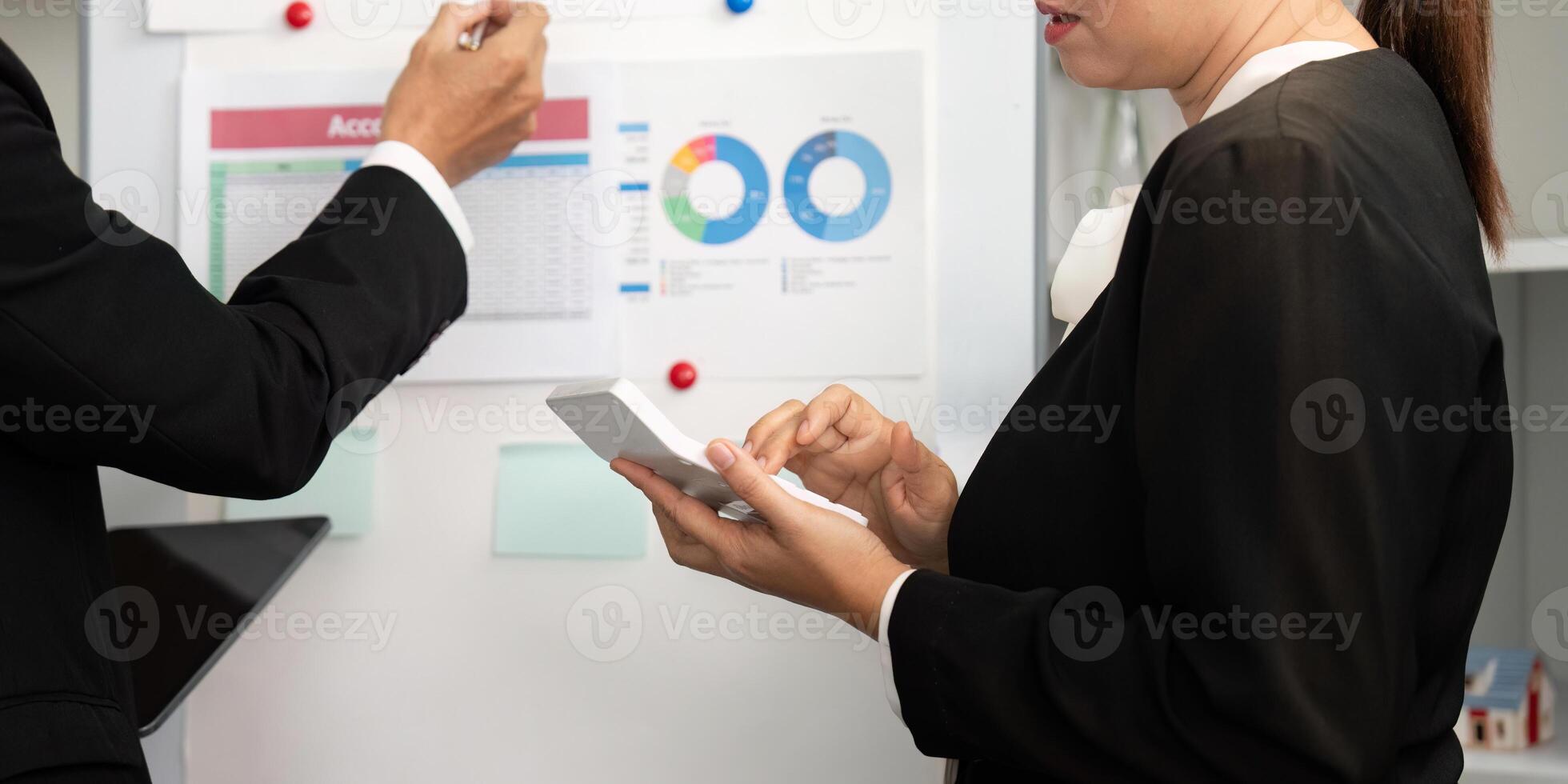 Business Collaboration and Data Analysis. Professionals discussing financial reports in modern office. photo