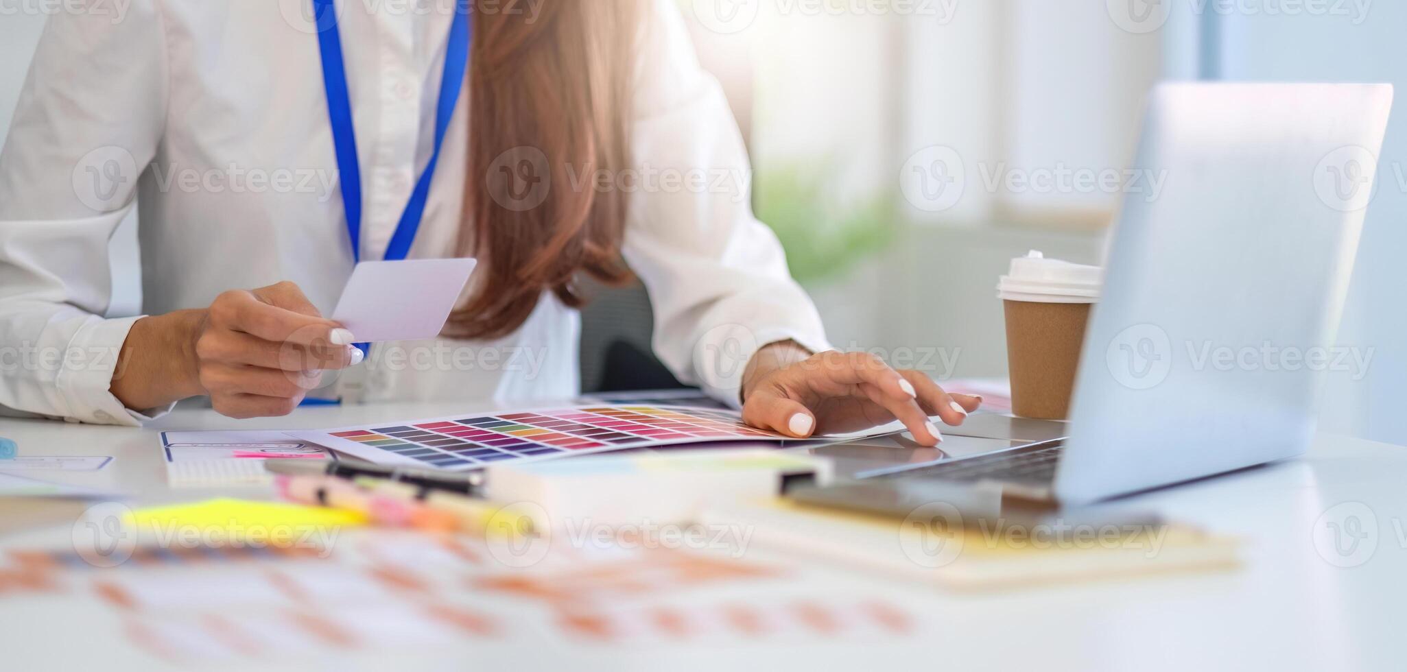 Creative Collaboration in Design. Professionals analyzing color palettes and layouts during a brainstorming session. photo