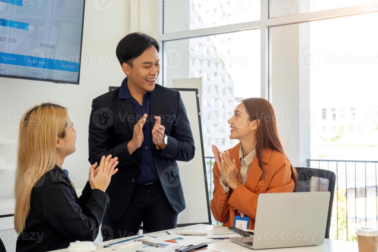Team Collaboration and Problem Solving. Business professionals discussing project challenges in a modern office. photo