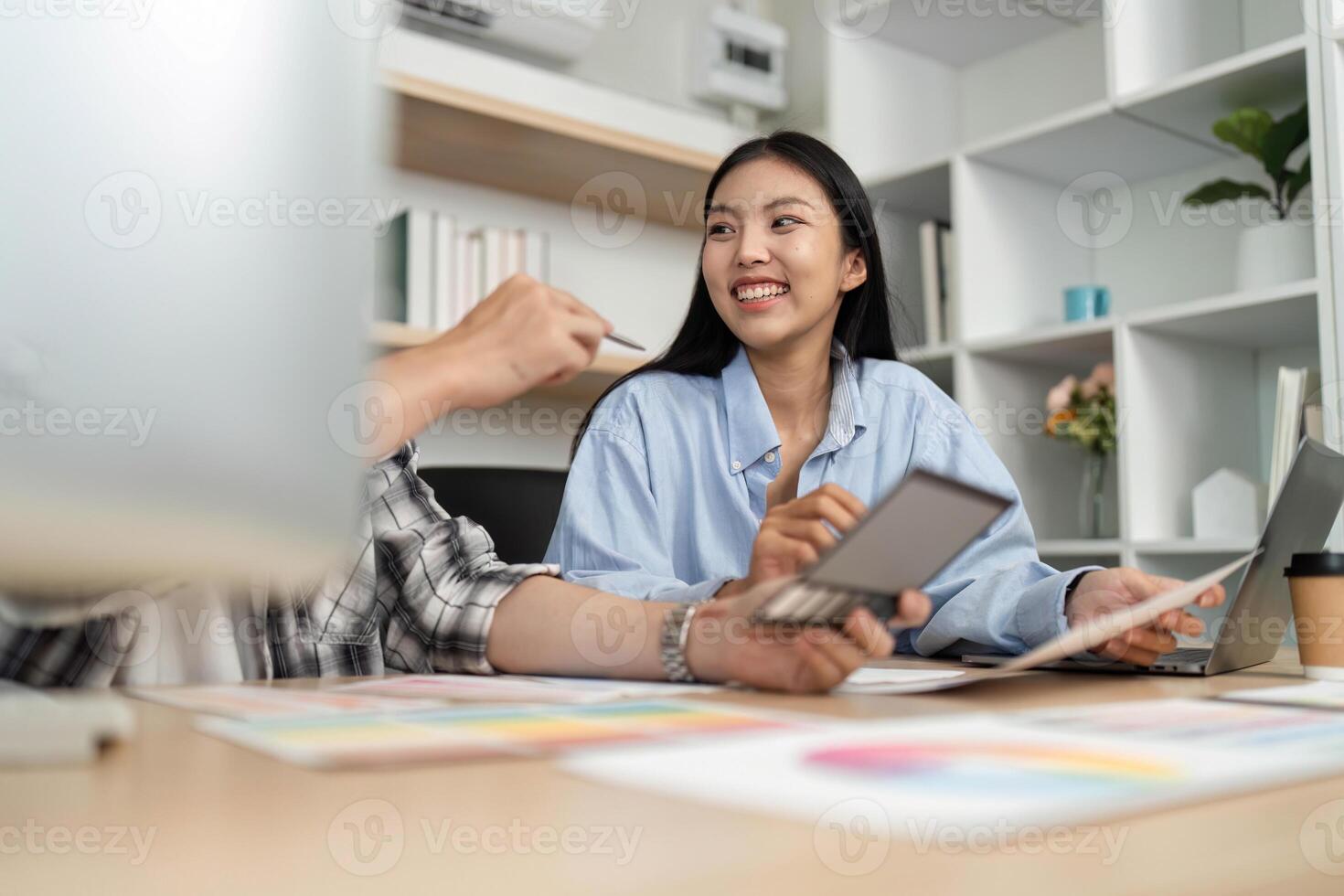 UX and UI Design Discussion. Smiling designer engaging in a creative meeting. photo