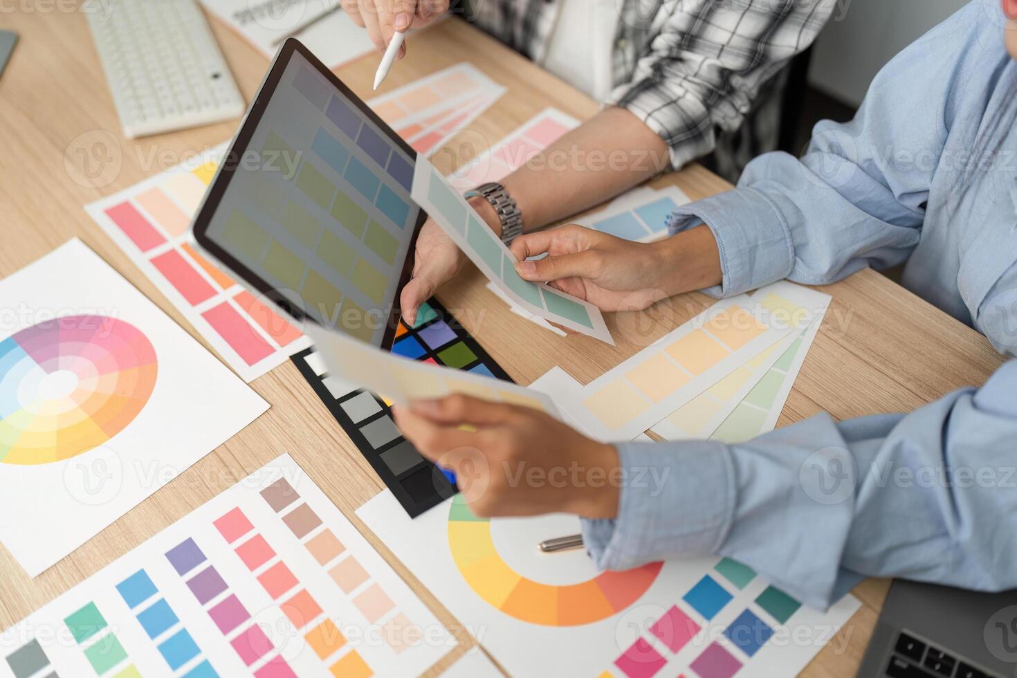 UX and UI Design Review. Designers analyzing color palettes and digital concepts. photo