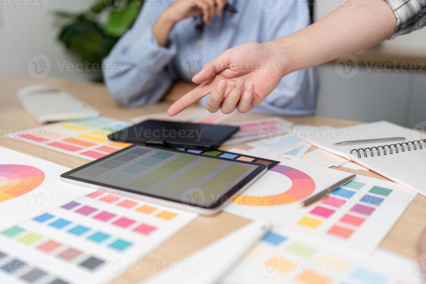 UX and UI Design Collaboration. Creative team discussing color palettes and design elements. photo