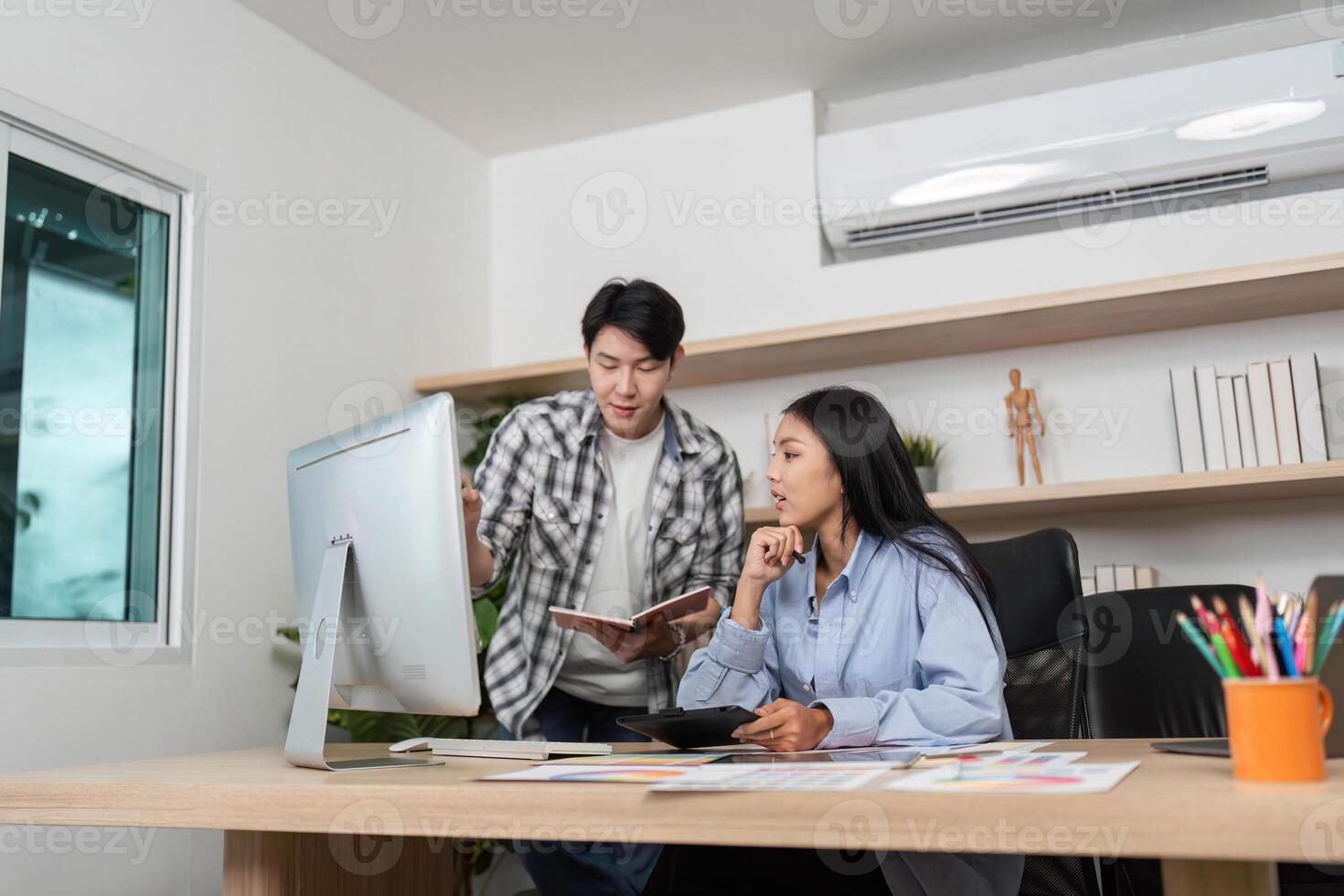 UX and UI Design Discussion. Designers collaborating on a project in a bright office. photo