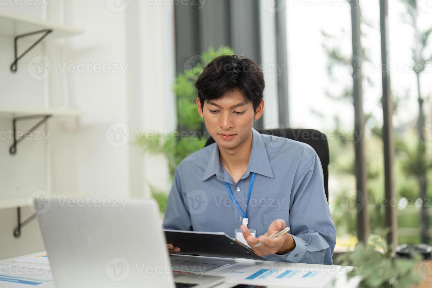 Remote Work and Communication. Young professional discussing documents on a call. photo