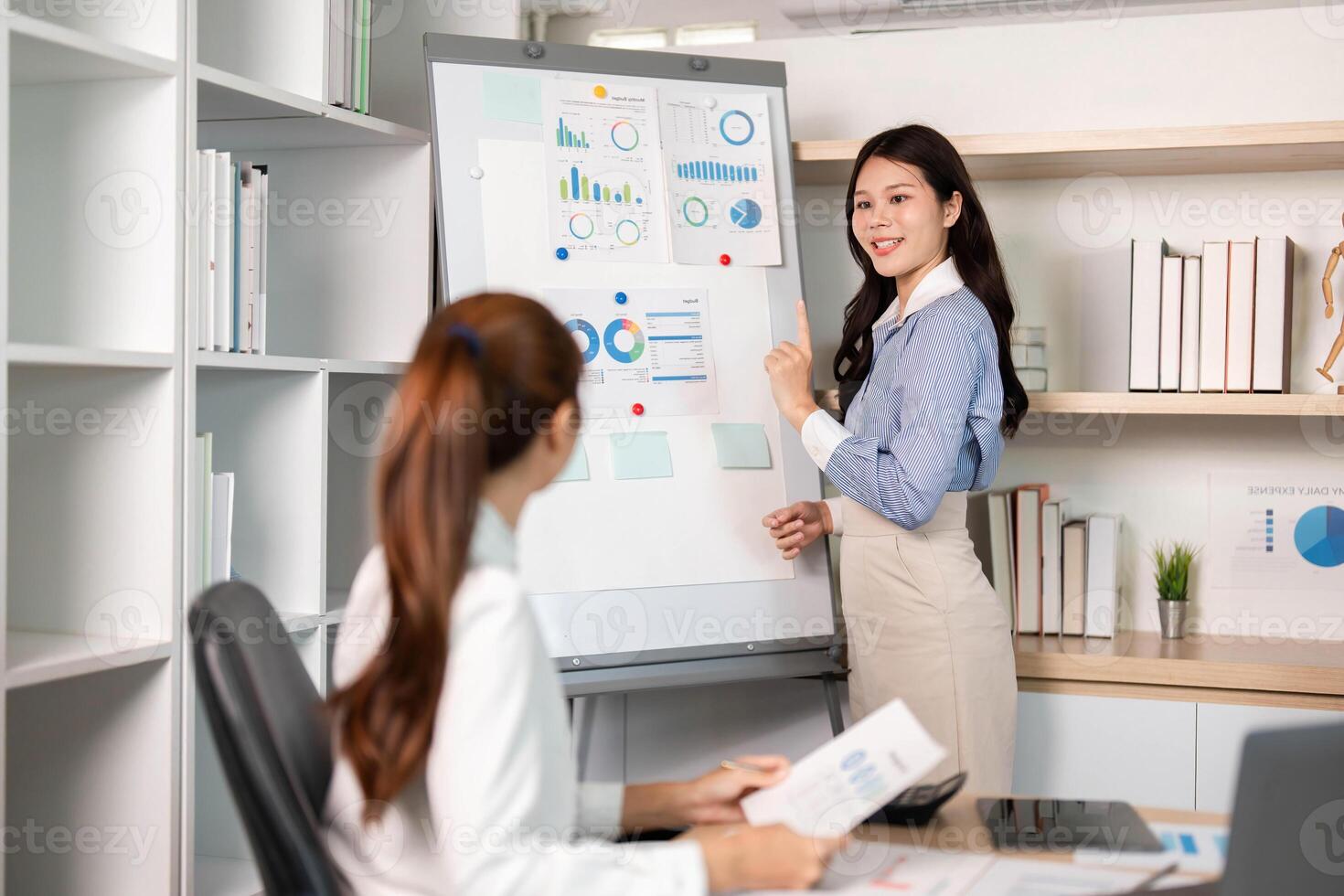 Business Presentation and Team Collaboration. A woman explaining data insights at a meeting. photo