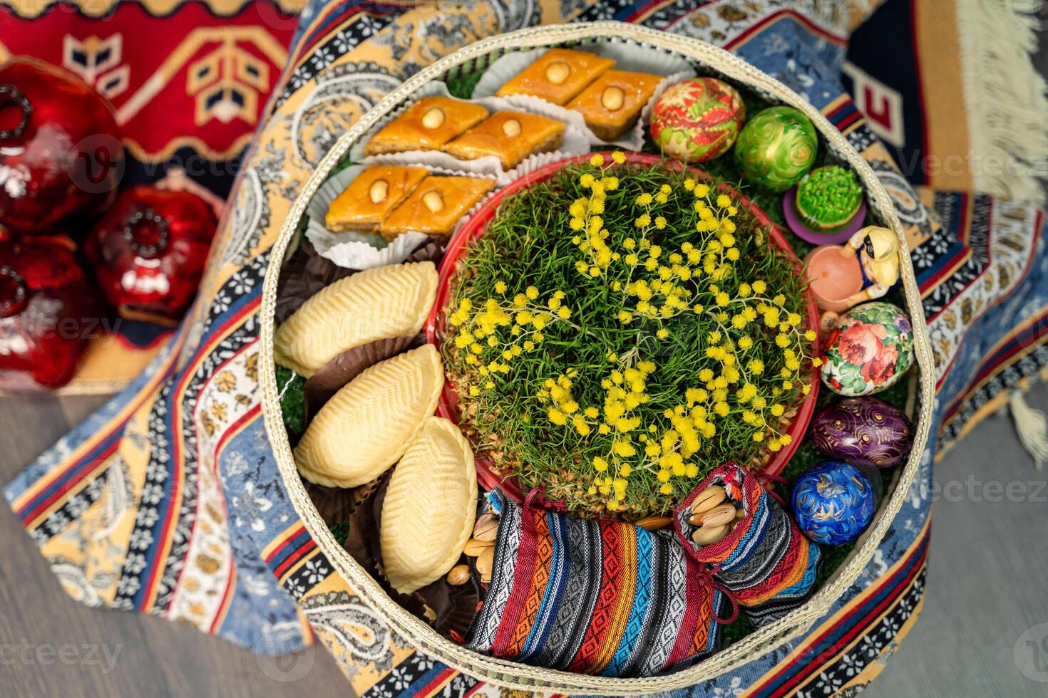 Novruz plate with Azerbaijan national pastry pakhlava and shekerbura and green semeni wheat grass photo