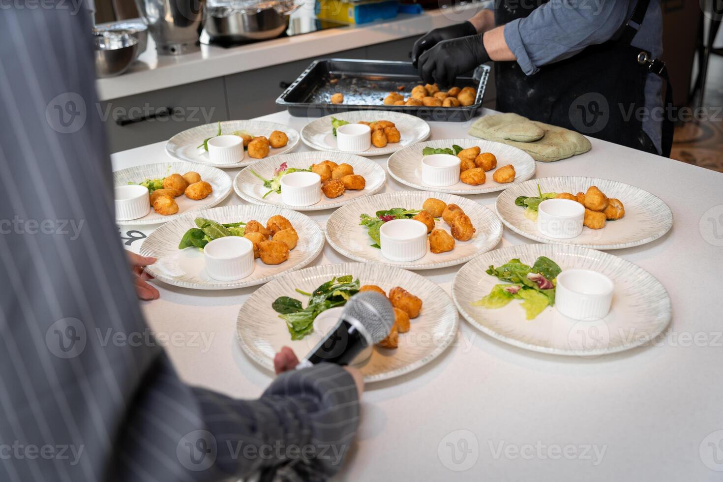Chef Preparing Plates for a Food Presentation Event photo