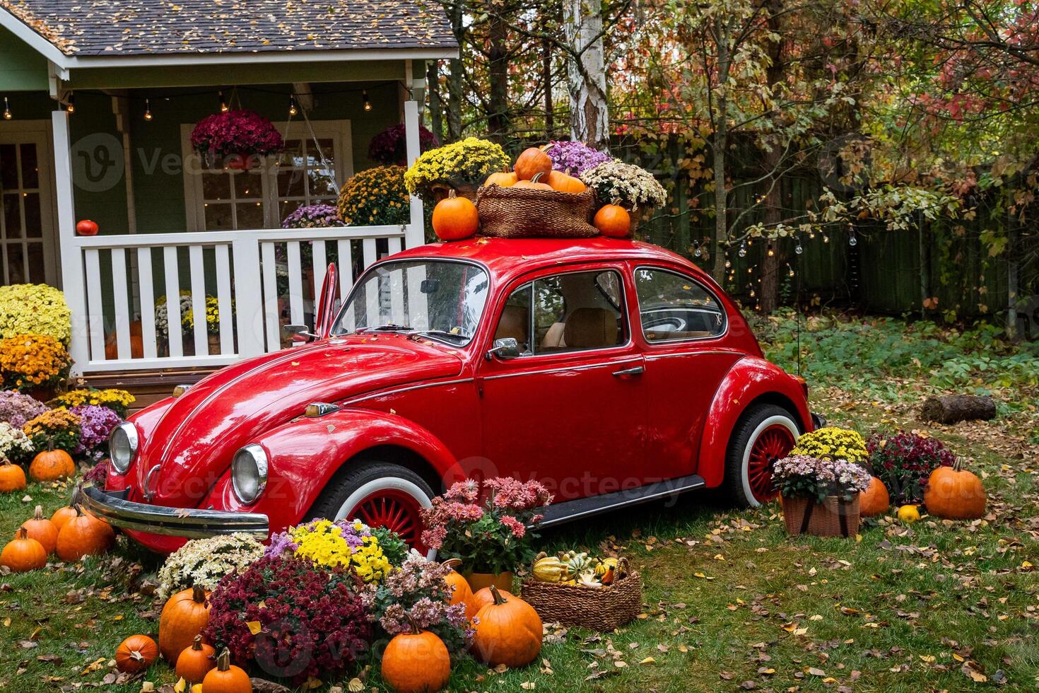 Vintage Car Adorned with Pumpkins in Autumn Scene photo