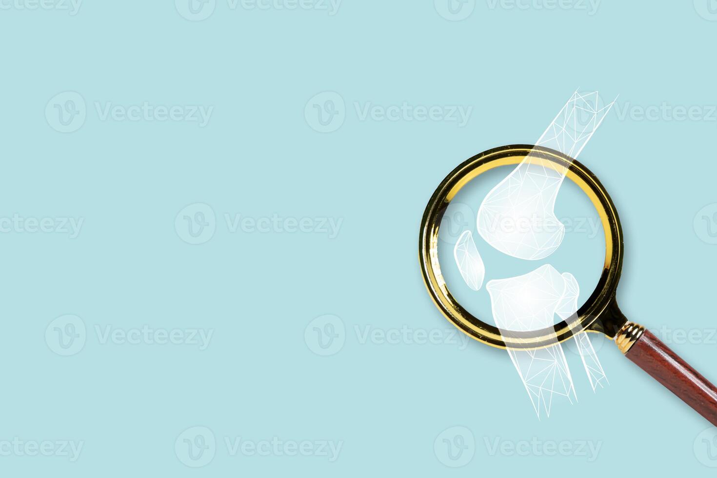 Magnifying Glass Focuses on Human Knee Joint with Polygon Bone Structure on Blue Background for Medical Concept photo