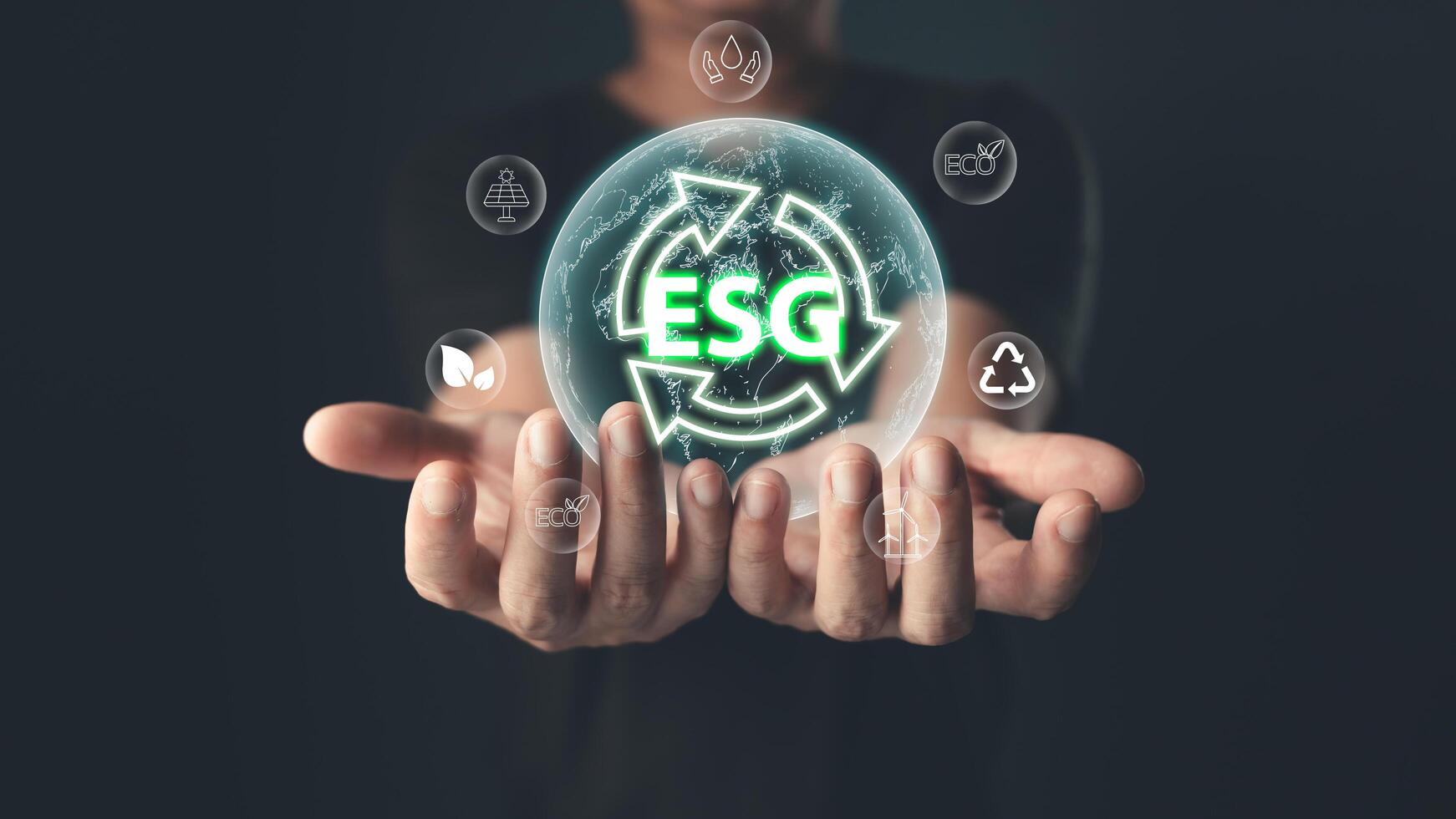 The glowing ESG icon symbolizes commitment to environmental, social,and governance principles,emphasizing sustainability,ethical practices,and eco-friendly solutions for a balanced,responsible future. photo