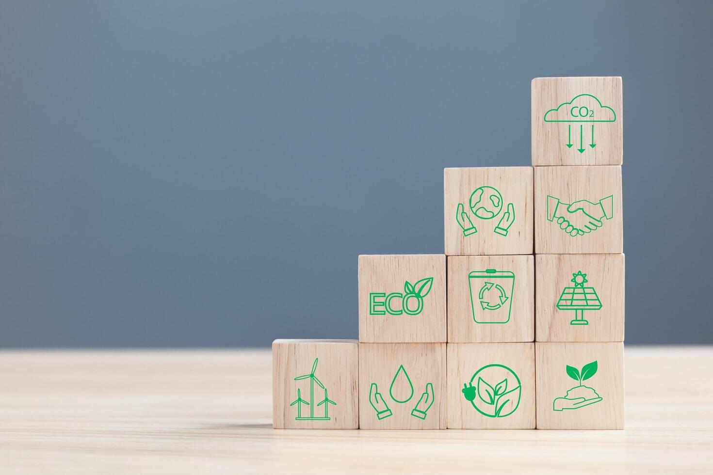 wood block with icon reduce co2,and reduce global warming,climate change,ecology friendly investment,ESG environment social governance,Green Business Innovation and Sustainable Development concept photo