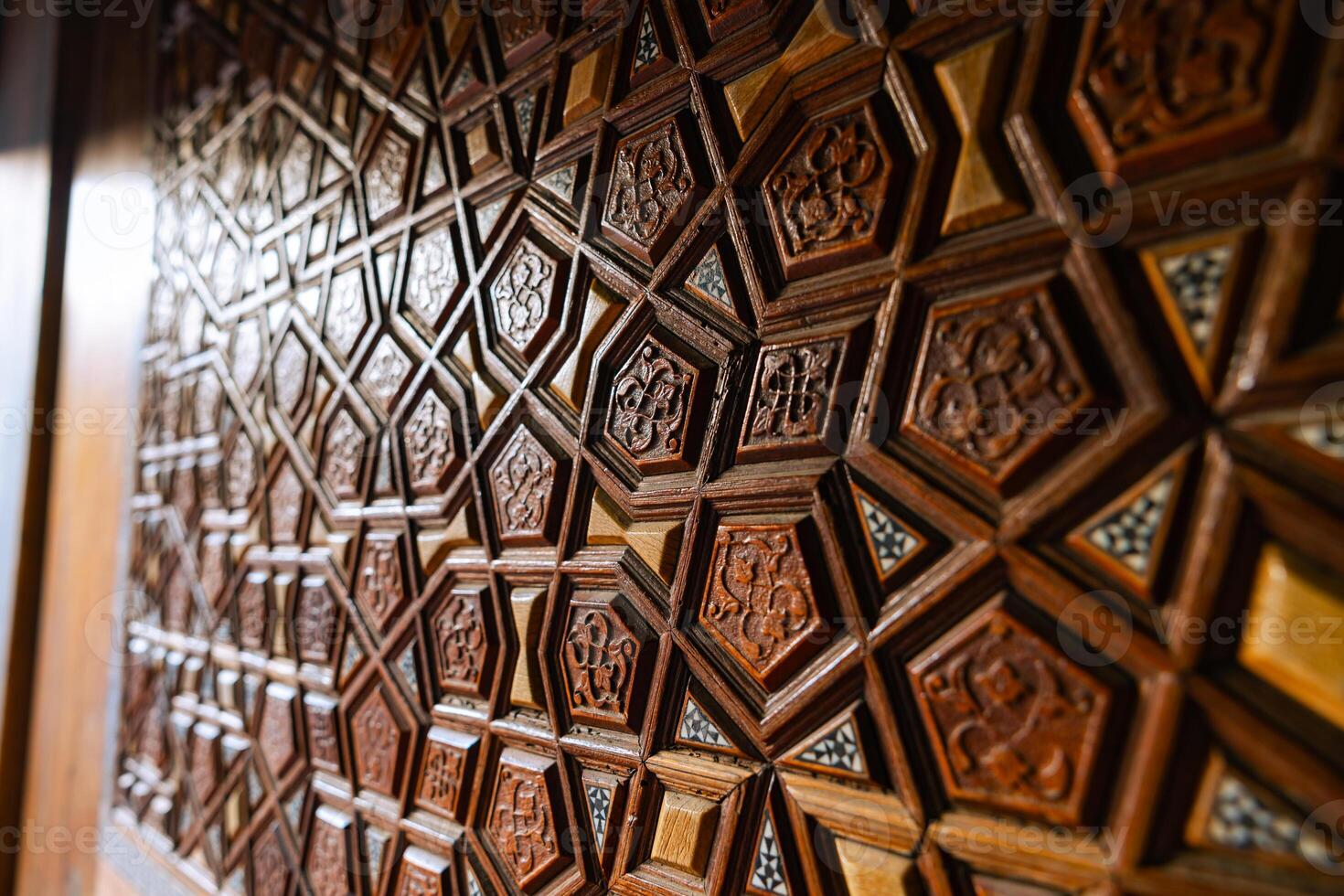 Islamic background. Islamic pattern on the wooden door of a mosque photo