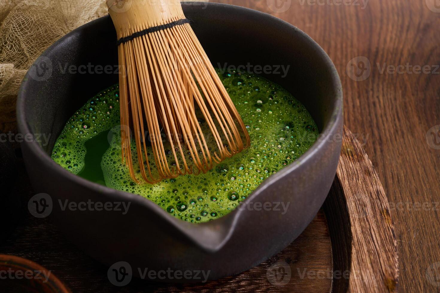 Matcha Preparation. Ceramic bowls and bamboo whisk for preparing matcha tea photo