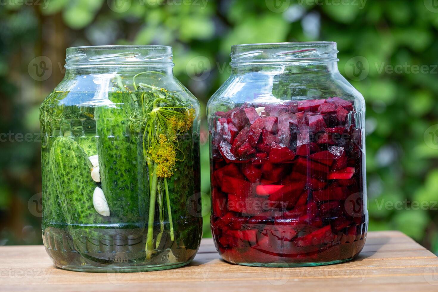 Jars Of Pickled Cucumbers And Beetroots photo