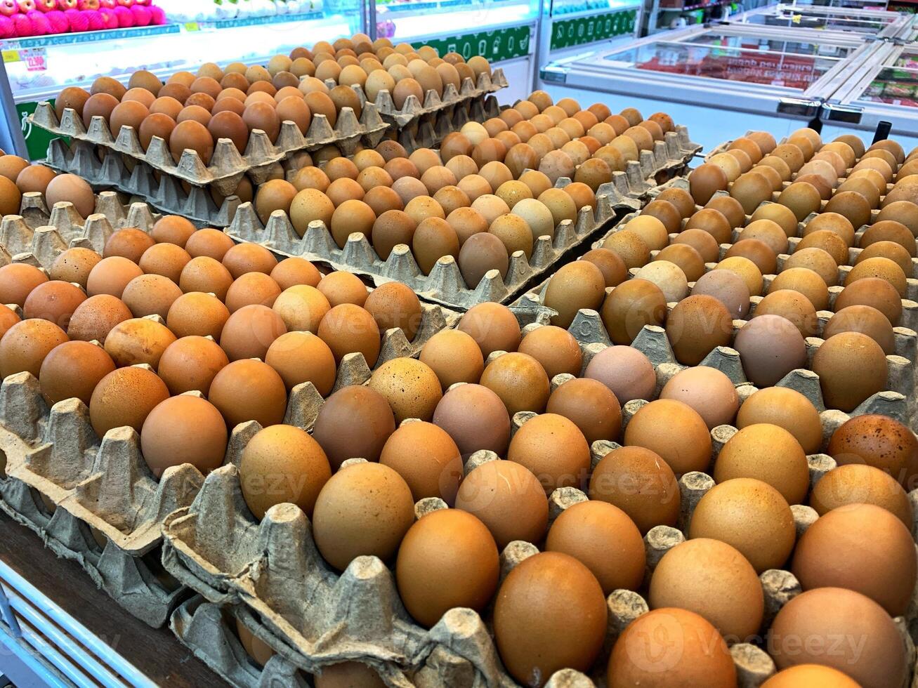 eggs in cartons are displayed in a store photo