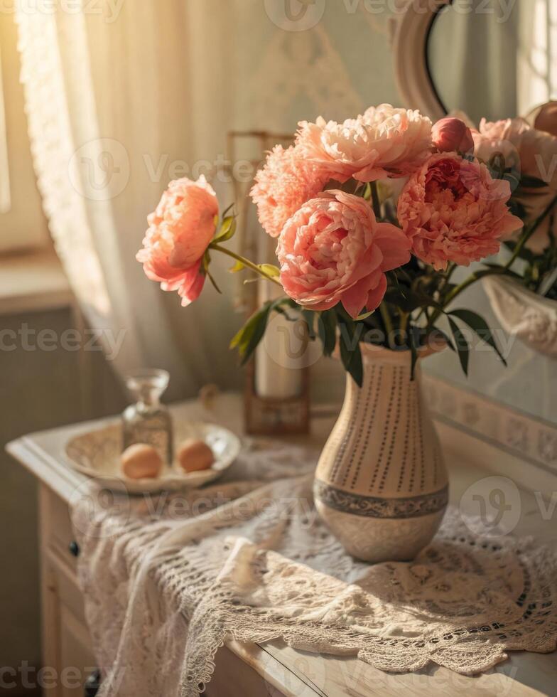 Faded coral peonies arrangement displayed on a dresser with lace covering photo