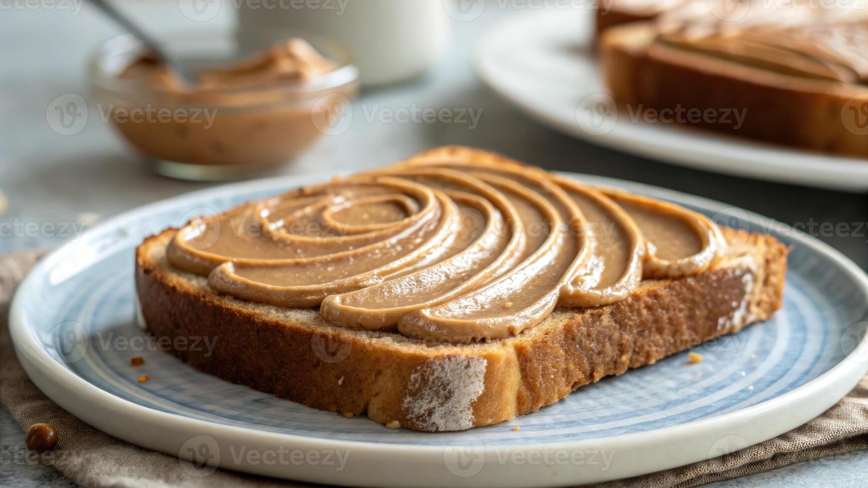 A delicious slice of toast with peanut butter, ready for breakfast or a snack. photo