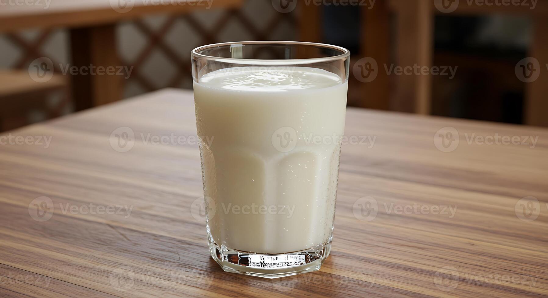 Refreshing Glass of Milk on Wooden Table photo
