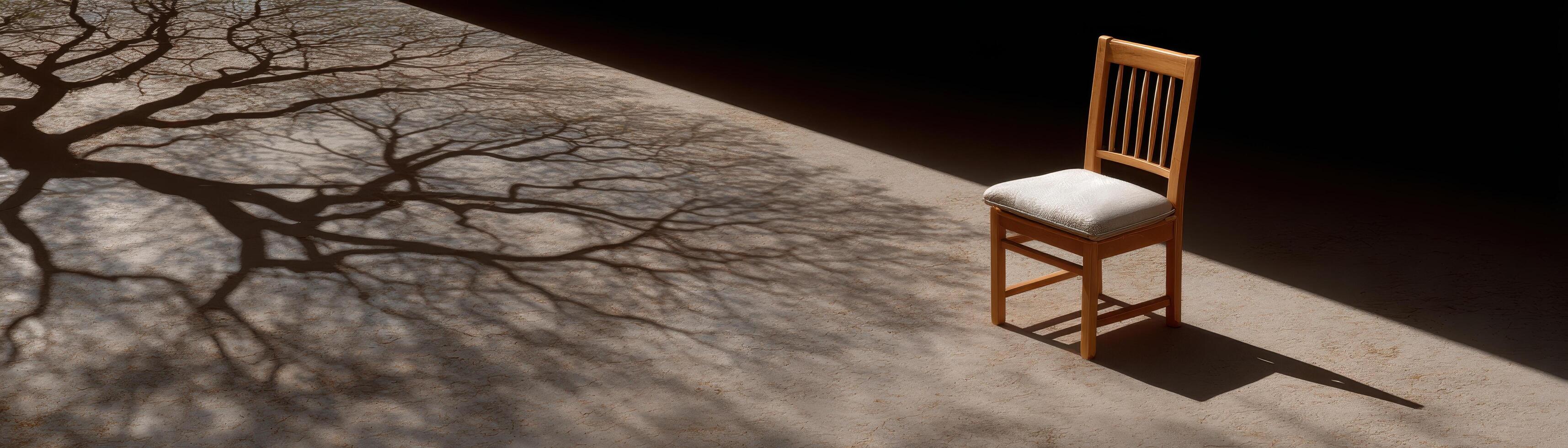 Solitary chair casting shadow in natural light artistic composition open space minimalist view photo