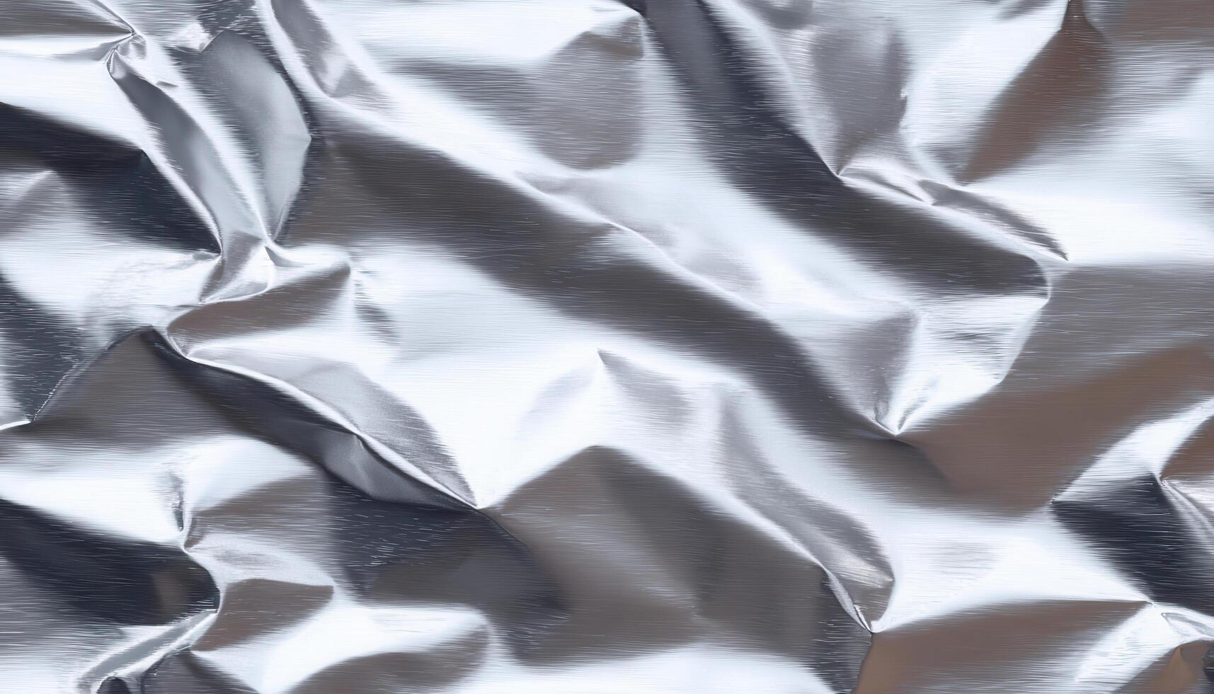 Reflective texture of wrinkled aluminum foil in low resolution abstract art close-up view photo