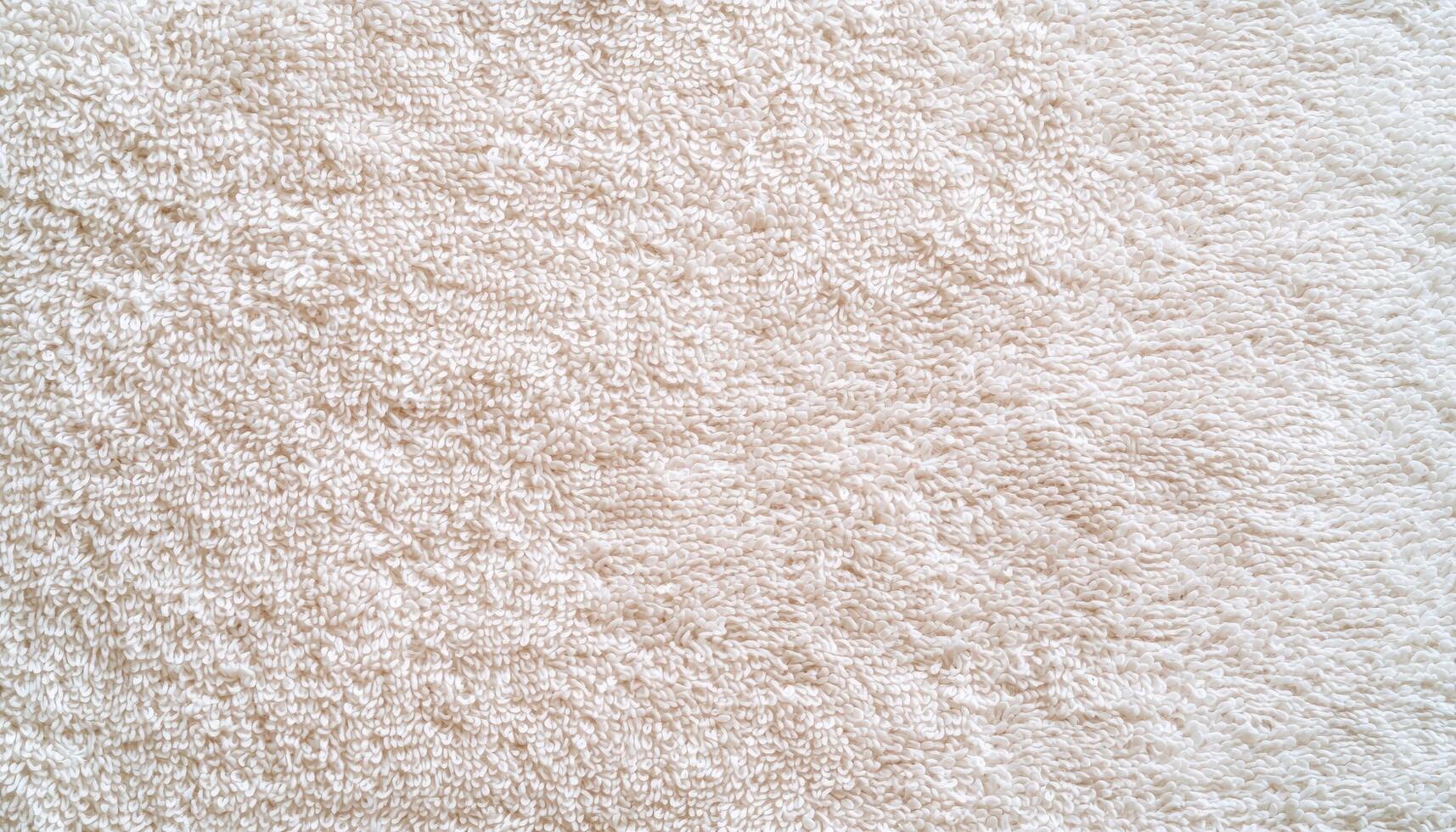 Closeup soft white towel texture in natural sunlight home setting photography warm atmosphere photo