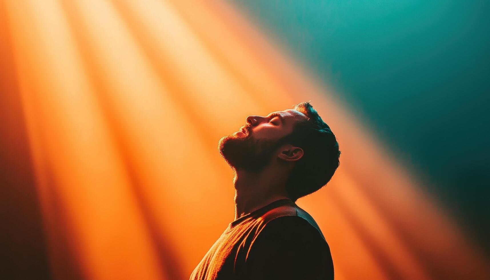 Person praying under shining light rays spiritual setting emotional content uplifting perspective photo